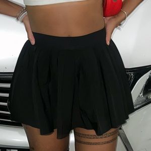 Black ruffle mini skirt